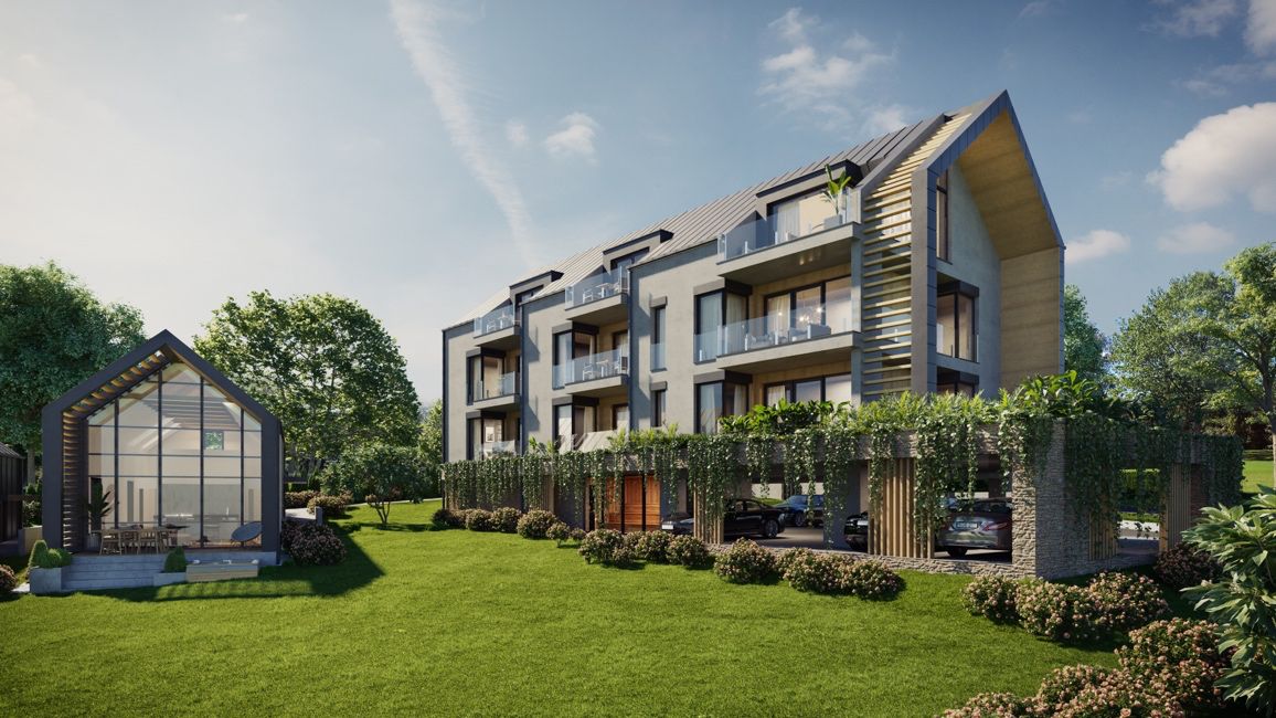A HillGate apartmanház Nemesbükön, kertből nézve, fedett parkolóval és üvegfalú pavilonnal